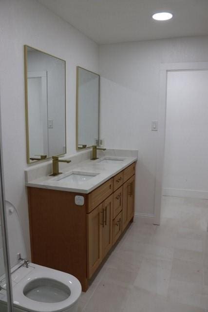 129 Oak Trl, Burleson, TX 76028 - bathroom featuring double vanity and baseboards