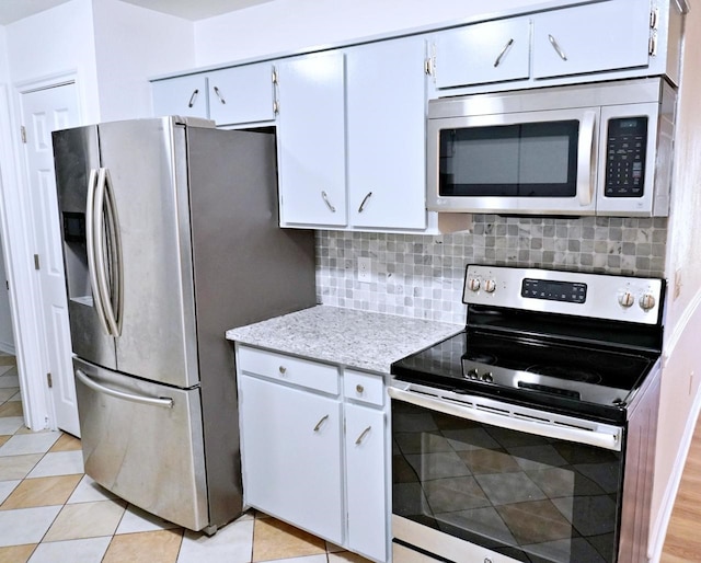 3429 Willowcrest Dr, North Richland Hills, TX 76117 - kitchen featuring stainless steel appliances, tasteful backsplash, white cabinets, and light stone countertops