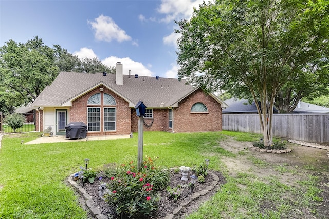 120 Driftwood Ln, Waxahachie, TX 75165 - back of house featuring a fenced backyard, brick siding, a chimney, roof with shingles, and a patio