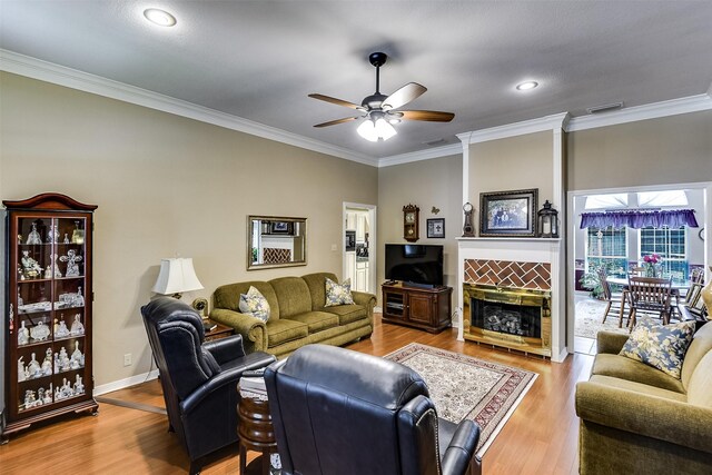 120 Driftwood Ln, Waxahachie, TX 75165 - living room featuring ornamental molding, ceiling fan, wood finished floors, recessed lighting, and a tiled fireplace
