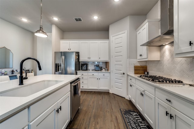 333 Foxthorne Way, Little Elm, TX 75068 - kitchen with wall chimney range hood, appliances with stainless steel finishes, white cabinets, light countertops, and recessed lighting