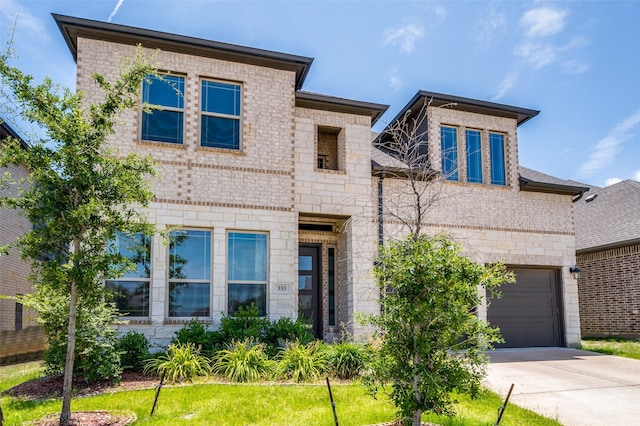 333 Foxthorne Way, Little Elm, TX 75068 - view of front of home featuring driveway, stone siding, and brick siding