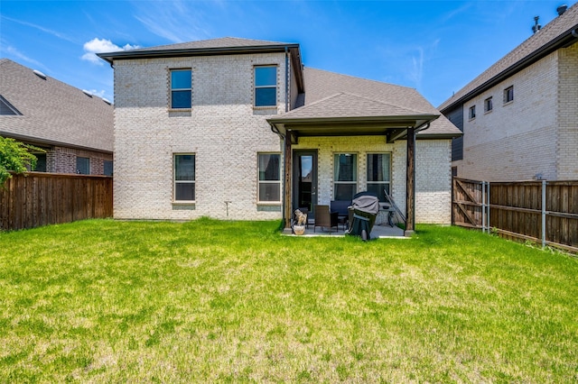 333 Foxthorne Way, Little Elm, TX 75068 - rear view of house with a patio, a fenced backyard, brick siding, and roof with shingles