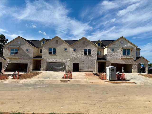 120 Homes Dr, Grand Prairie, TX 75050 - view of property with an attached garage and concrete driveway