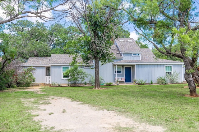 3125 County Road 264, Breckenridge, TX 76424 - view of front of property featuring a shingled roof, a front yard, and board and batten siding