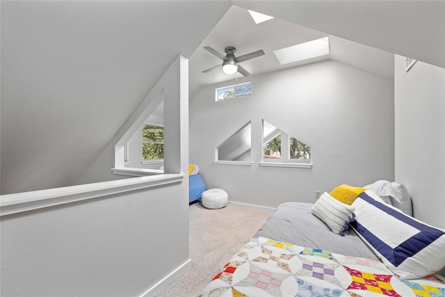 3125 County Road 264, Breckenridge, TX 76424 - carpeted bedroom featuring a skylight, vaulted ceiling, and a ceiling fan