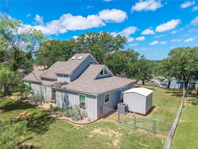 3125 County Road 264, Breckenridge, TX 76424 - back of house featuring a shingled roof, a shed, a gate, and board and batten siding