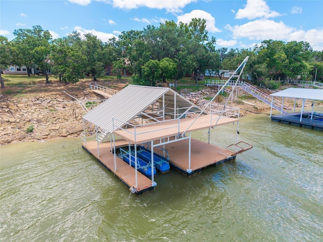 3125 County Road 264, Breckenridge, TX 76424 - dock with boat lift, view of scattered trees, and a water view