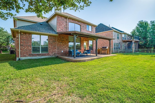 2469 Sleepy Hollow Trl, Frisco, TX 75033 - back of house featuring a fenced backyard, a shingled roof, brick siding, and a patio area