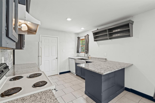 1212 E Mulkey St, Fort Worth, TX 76104 - kitchen with white appliances, range hood, a peninsula, light tile patterned flooring, and open shelves