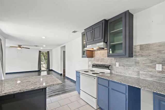 1212 E Mulkey St, Fort Worth, TX 76104 - kitchen featuring white electric range, ceiling fan, light tile patterned floors, under cabinet range hood, and glass insert cabinets