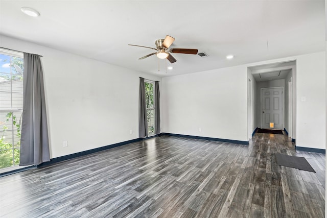1212 E Mulkey St, Fort Worth, TX 76104 - unfurnished room with attic access, wood finished floors, healthy amount of natural light, a ceiling fan, and recessed lighting