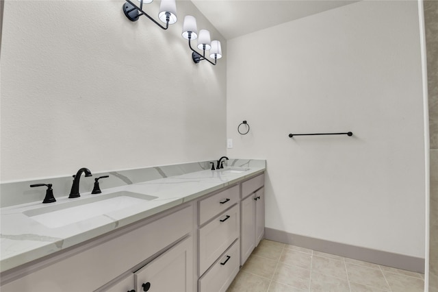 1604 Franklin St, Weatherford, TX 76086 - bathroom featuring double vanity and baseboards