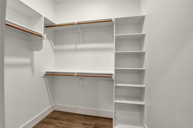 1604 Franklin St, Weatherford, TX 76086 - walk in closet with dark wood-type flooring
