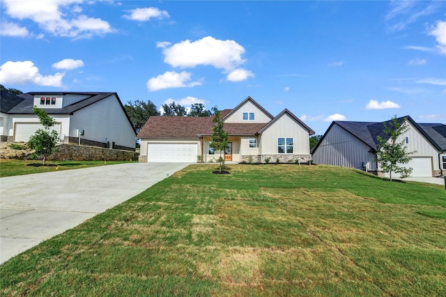 1604 Franklin St, Weatherford, TX 76086 - view of front facade with concrete driveway, a garage, board and batten siding, a front yard, and stone siding