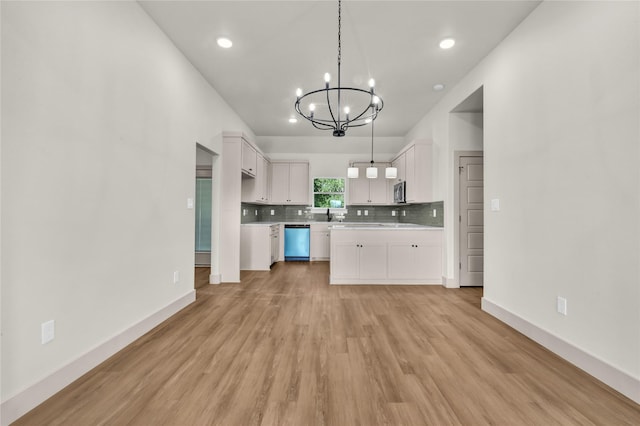 1604 Franklin St, Weatherford, TX 76086 - kitchen with dishwashing machine, a chandelier, light countertops, backsplash, and light wood-type flooring