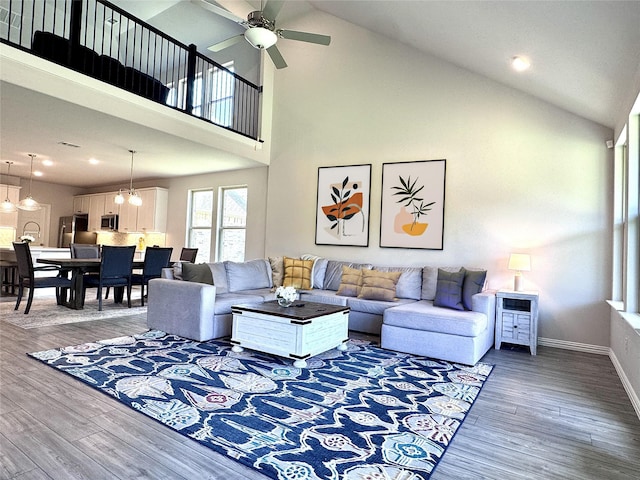 7204 Silent Mill Rd, Arlington, TX 76001 - living room with wood finished floors, a ceiling fan, high vaulted ceiling, and recessed lighting