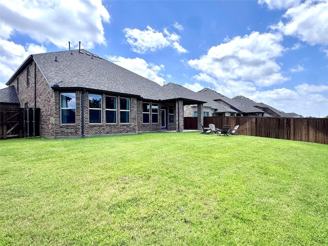 7204 Silent Mill Rd, Arlington, TX 76001 - rear view of property with brick siding, a fenced backyard, and a shingled roof