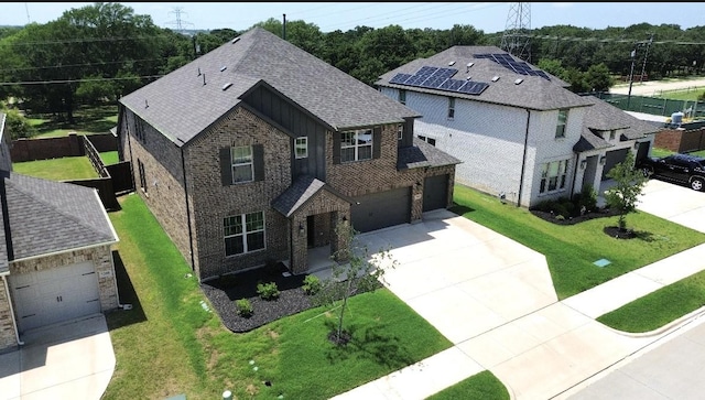 7204 Silent Mill Rd, Arlington, TX 76001 - view of front of property featuring driveway, a shingled roof, brick siding, board and batten siding, and a front lawn
