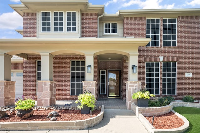 4309 Founders Dr, Rowlett, TX 75089 - doorway to property featuring covered porch and brick siding