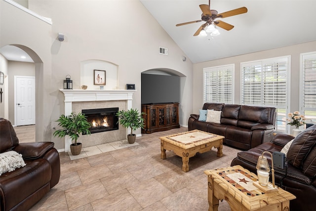 4309 Founders Dr, Rowlett, TX 75089 - living area with a ceiling fan, arched walkways, high vaulted ceiling, and a fireplace