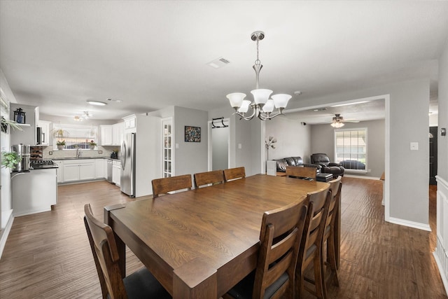 3012 Lisa Ln, Arlington, TX 76013 - dining area featuring wood finished floors, a chandelier, and ceiling fan