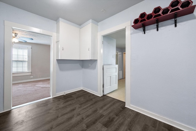 318 Mckenzie St, Waxahachie, TX 75165 - empty room with dark wood-type flooring and ceiling fan
