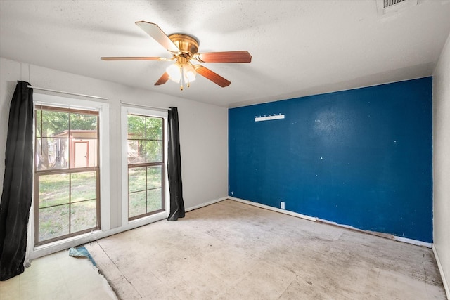 318 Mckenzie St, Waxahachie, TX 75165 - spare room featuring ceiling fan and baseboards