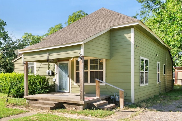 318 Mckenzie St, Waxahachie, TX 75165 - rear view of property featuring roof with shingles