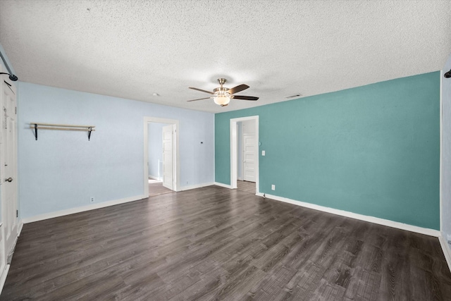 318 Mckenzie St, Waxahachie, TX 75165 - empty room featuring a ceiling fan, a textured ceiling, and dark wood finished floors