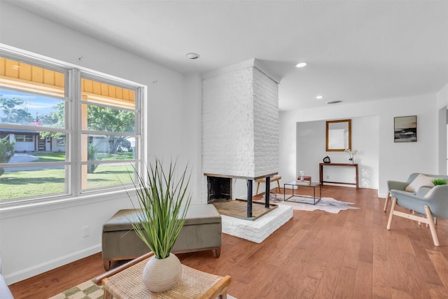 5624 Waltham Ave, Fort Worth, TX 76133 - living room with wood finished floors, recessed lighting, and a brick fireplace