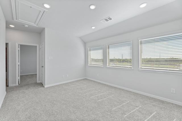 1957 Jade Forest Ln, Mesquite, TX 75181 - spare room featuring attic access, light carpet, recessed lighting, and vaulted ceiling
