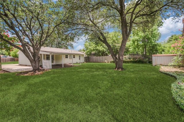 1712 Arbor Ln, Arlington, TX 76010 - fenced backyard with a patio area