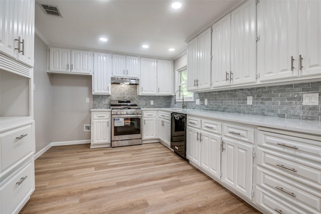 1712 Arbor Ln, Arlington, TX 76010 - kitchen featuring gas range, under cabinet range hood, dishwasher, light wood-style flooring, and backsplash