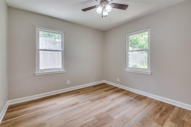 1712 Arbor Ln, Arlington, TX 76010 - spare room with plenty of natural light, light wood finished floors, and a ceiling fan
