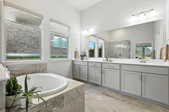 11720 Bull Creek Dr, Northlake, TX 76226 - full bathroom with double vanity, a garden tub, and a shower stall