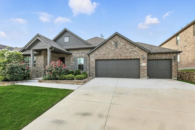 11720 Bull Creek Dr, Northlake, TX 76226 - view of front of property with an attached garage, a front yard, roof with shingles, driveway, and brick siding