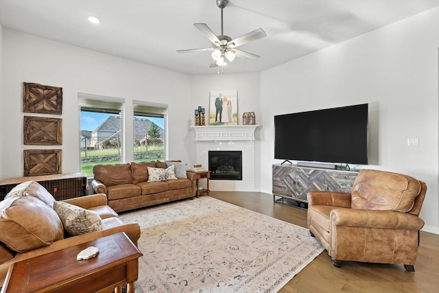 11720 Bull Creek Dr, Northlake, TX 76226 - living area with a glass covered fireplace, a ceiling fan, wood finished floors, and recessed lighting