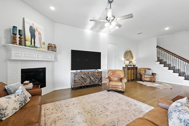 11720 Bull Creek Dr, Northlake, TX 76226 - living area featuring wood finished floors, a ceiling fan, stairs, recessed lighting, and a fireplace