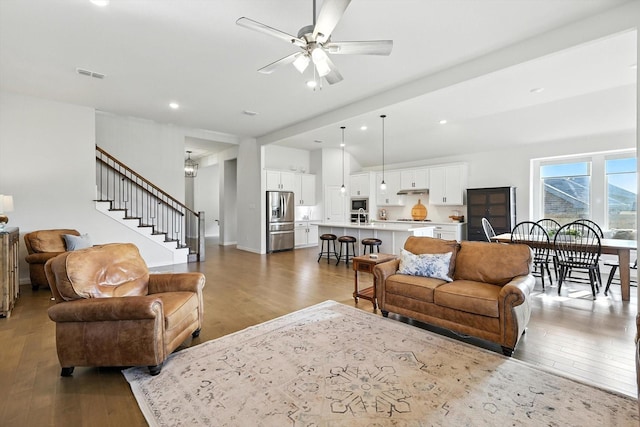 11720 Bull Creek Dr, Northlake, TX 76226 - living area with wood-type flooring, stairs, ceiling fan, recessed lighting, and lofted ceiling