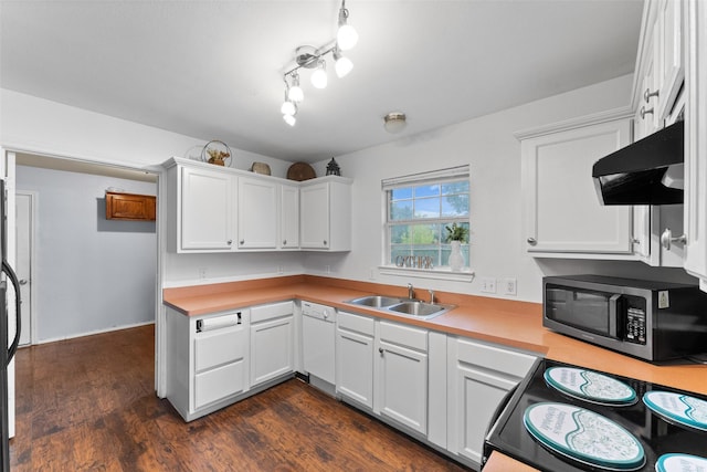 3227 Baskin Dr, Lancaster, TX 75134 - kitchen featuring range hood, light countertops, white cabinets, and dark wood finished floors