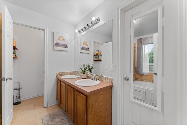 3227 Baskin Dr, Lancaster, TX 75134 - bathroom featuring double vanity, tile patterned flooring, and a bath
