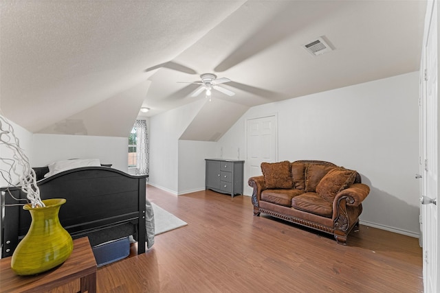 3227 Baskin Dr, Lancaster, TX 75134 - interior space featuring wood finished floors, a ceiling fan, and vaulted ceiling