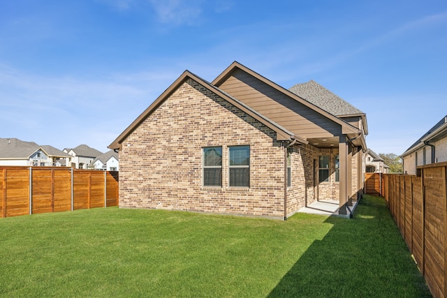 2021 Jade Frst, Mesquite, TX 75181 - back of property with brick siding and a fenced backyard
