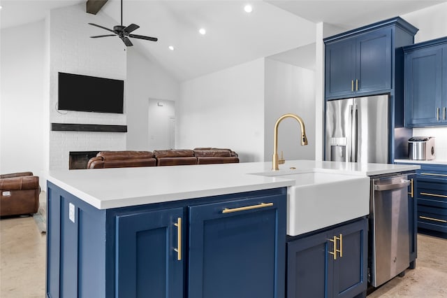 177 Mel Dr, Woodway, TX 76712 - kitchen featuring appliances with stainless steel finishes, blue cabinets, open floor plan, vaulted ceiling, and recessed lighting