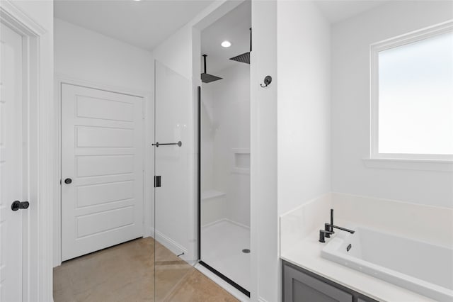 177 Mel Dr, Woodway, TX 76712 - bathroom with a stall shower, a garden tub, tile patterned floors, and recessed lighting