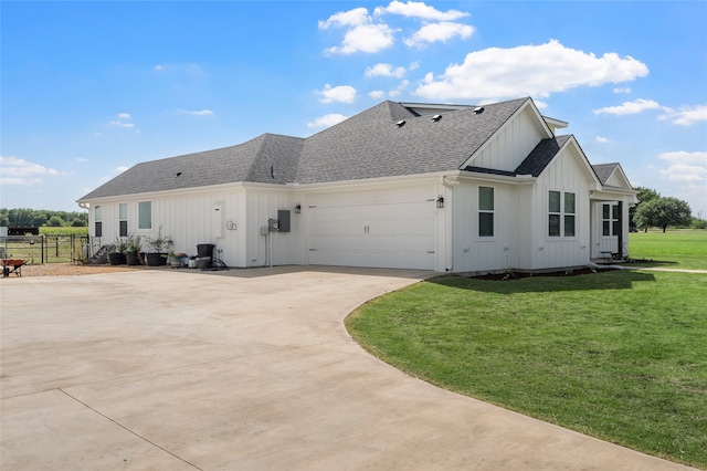 177 Mel Dr, Woodway, TX 76712 - view of side of home featuring board and batten siding, a shingled roof, an attached garage, and concrete driveway