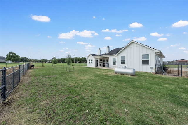 177 Mel Dr, Woodway, TX 76712 - rear view of property featuring board and batten siding, a fenced backyard, a chimney, and a patio
