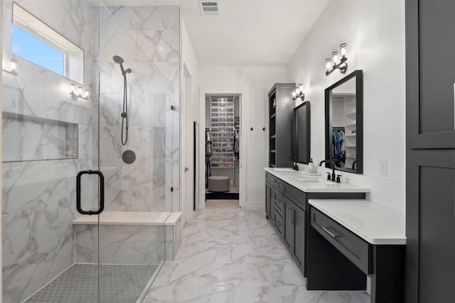 1301 Incline Cir, Garland, TX 75040 - bathroom with a walk in closet, marble look tile flooring, a marble finish shower, and vanity