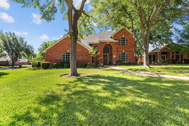 1 Cimarron Ct, Trophy Club, TX 76262 - view of front of property featuring brick siding, a front lawn, and a shingled roof
